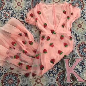Berry cute and oh-so-sweet, this strawberries dress is the perfect treat!
